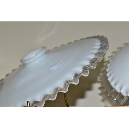 354 - FOUR GLASS LAMPSHADES, each in white opaque glass with a clear wavy edge, slight variations in size ... 