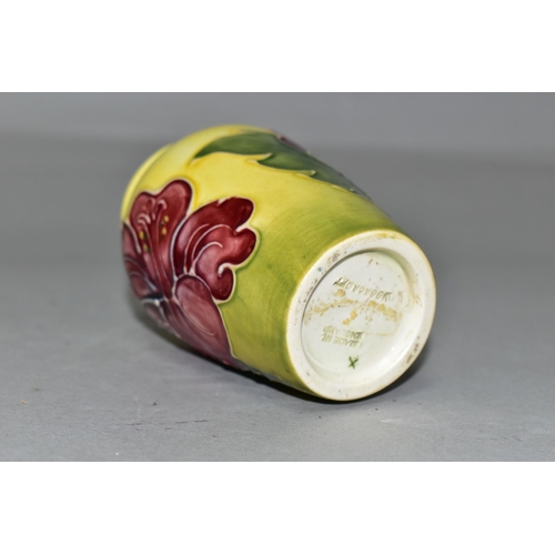 356 - A SMALL MOORCROFT POTTERY HIBISCUS VASE, tube lined with red/purple hibiscus on a graduated yellow a... 