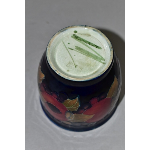 361 - A SMALL MOORCROFT POTTERY POMEGRANATE PLANTER,  tube lined with pomegranates and berries on a navy b... 