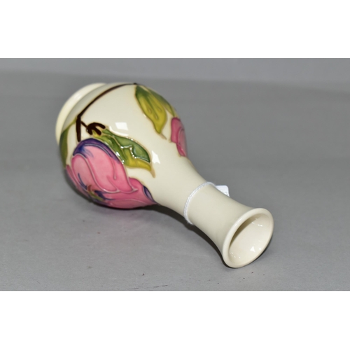 367 - A MOORCROFT POTTERY MAGNOLIA VASE, of bottle form, decorated with tube lined pink Magnolia pattern o... 