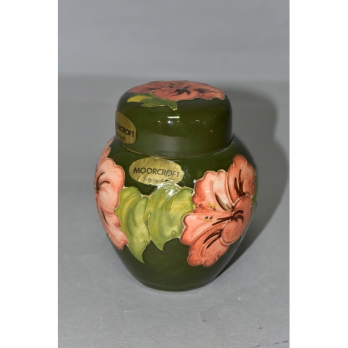 368 - A MOORCROFT POTTERY SMALL GINGER JAR AND COVER, in the Coral Hibiscus pattern on a green ground, bea... 