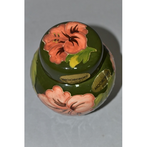 368 - A MOORCROFT POTTERY SMALL GINGER JAR AND COVER, in the Coral Hibiscus pattern on a green ground, bea... 