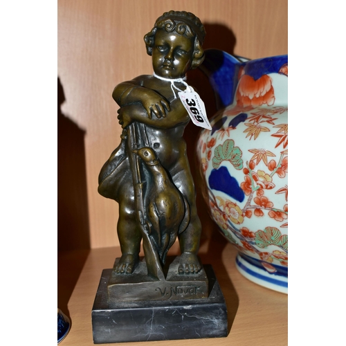 369 - A BRONZE FIGURE AND A GROUP OF CERAMICS, comprising a bronze figure of a boy with a gun and two bird... 