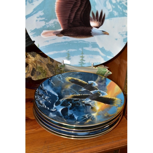 379 - A COLLECTION OF BALD EAGLE ORNAMENTS AND COLLECTOR'S PLATES, comprising an Italian RCR  mantel clock... 