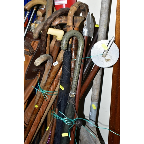 395 - A LARGE QUANTITY OF WALKING STICKS AND A SET VINTAGE GOLF CLUBS, to include a set of Dunlop 'Arnold ... 