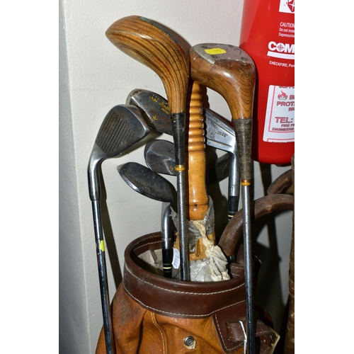 395 - A LARGE QUANTITY OF WALKING STICKS AND A SET VINTAGE GOLF CLUBS, to include a set of Dunlop 'Arnold ... 