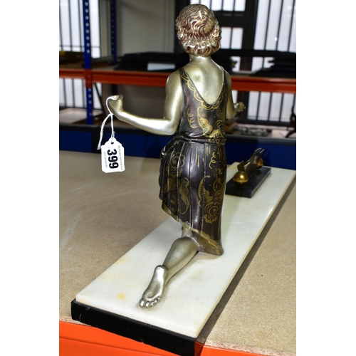 399 - AN ART DECO FIGURAL PHOTOGRAPH FRAME, the painted spelter kneeling female figure, wearing a short fl... 