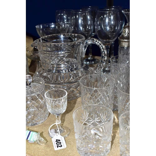 402 - A GROUP OF CUT CRYSTAL AND OTHER GLASSWARES, over thirty pieces to include a set of four Waterford C... 