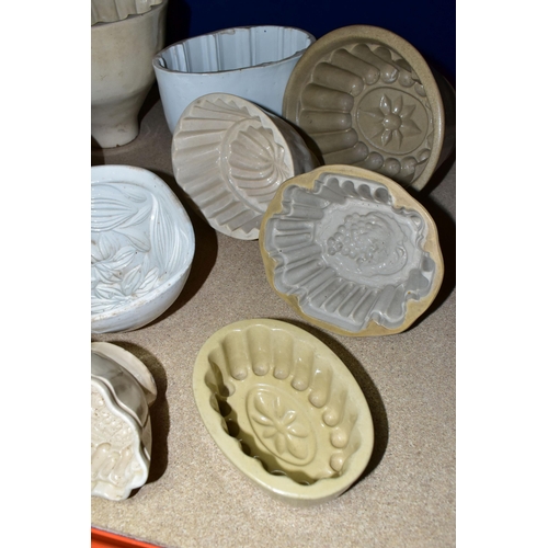 403 - TEN CERAMIC JELLY MOULDS, of varied sizes and designs, to include late Victorian/Edwardian and later... 