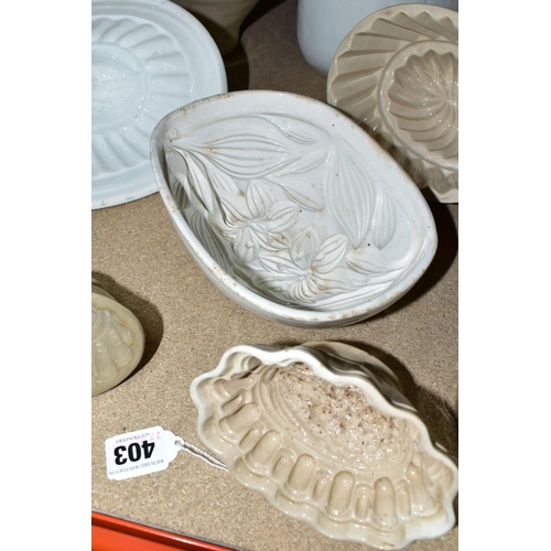 403 - TEN CERAMIC JELLY MOULDS, of varied sizes and designs, to include late Victorian/Edwardian and later... 