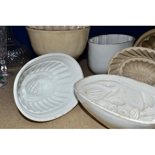 403 - TEN CERAMIC JELLY MOULDS, of varied sizes and designs, to include late Victorian/Edwardian and later... 