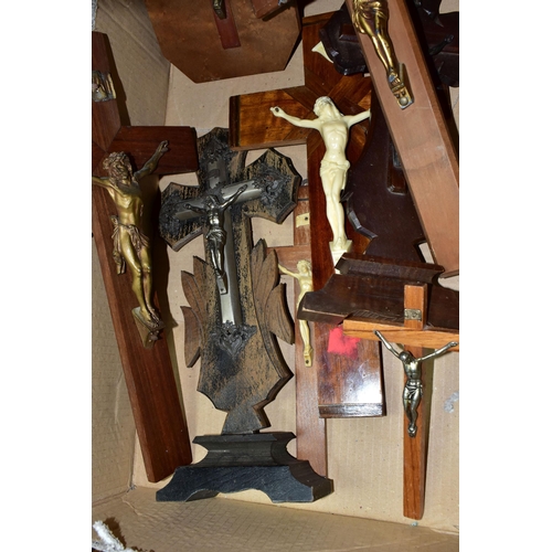 411 - A BOX OF EIGHT CRUCIFIXES, to include two freestanding examples, one mounted to an octagonal wooden ... 