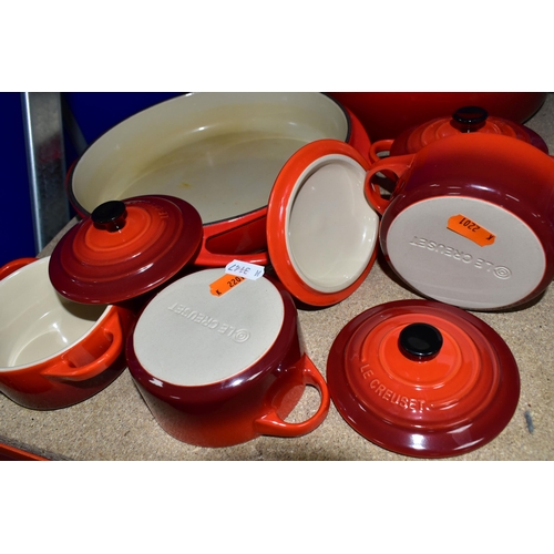 420 - A GROUP OF LE CREUSET COOKWARES, comprising a cast iron round casserole dish with cover, diameter 24... 