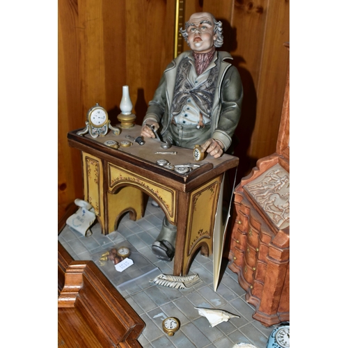 444 - A CAPODIMONTE PORCELAIN TABLEAU 'THE CLOCK MAKER', sculpted by Mario Angela, modelled as a gentleman... 