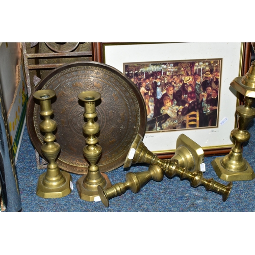 466 - A GROUP OF METALWARE, comprising  three pairs of brass candlesticks, a circular Middle Eastern brass... 