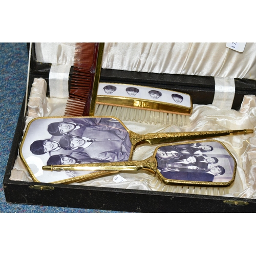 469 - THE BEATLES, A CASED DRESSING TABLE SET in lidded and lined covered wooden case with mirror and two ... 