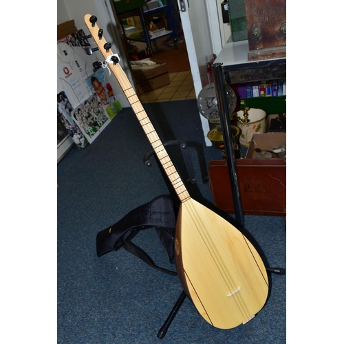 485 - A UNBRANDED TURKISH LONG NECKED BAGLAMA with bowl back, fretwork sound hole to top edge, ebony tunin... 