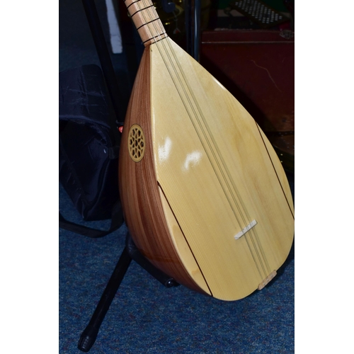 485 - A UNBRANDED TURKISH LONG NECKED BAGLAMA with bowl back, fretwork sound hole to top edge, ebony tunin... 