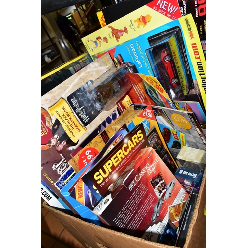 537 - FOUR BOXES OF TOYS AND GAMES ETC, to include battery operated robots, diecast vehicles including a b... 