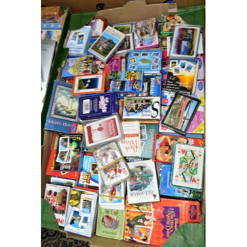 539 - THREE BOXES OF PUZZLES AND GAMES containing a very large collection of playing cards from around the... 