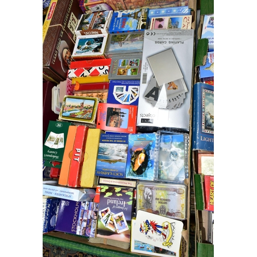 539 - THREE BOXES OF PUZZLES AND GAMES containing a very large collection of playing cards from around the... 