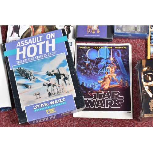 130 - A COLLECTION OF STAR WARS COLLECTABLES, VHS, FIGURES AND GAMES, to include a sealed Star wars Trilog... 