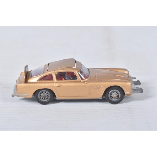 155 - A BOXED CORGI TOYS JAMES BOND ASTON MARTIN D.B.5, No.261, an example of the rarer toffee gold versio... 