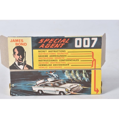 155 - A BOXED CORGI TOYS JAMES BOND ASTON MARTIN D.B.5, No.261, an example of the rarer toffee gold versio... 