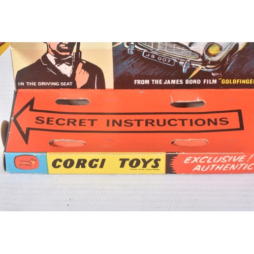 155 - A BOXED CORGI TOYS JAMES BOND ASTON MARTIN D.B.5, No.261, an example of the rarer toffee gold versio... 