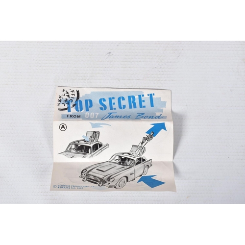 155 - A BOXED CORGI TOYS JAMES BOND ASTON MARTIN D.B.5, No.261, an example of the rarer toffee gold versio... 