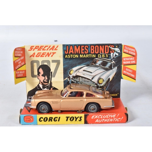 155 - A BOXED CORGI TOYS JAMES BOND ASTON MARTIN D.B.5, No.261, an example of the rarer toffee gold versio... 