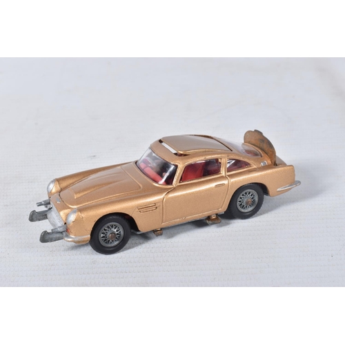 155 - A BOXED CORGI TOYS JAMES BOND ASTON MARTIN D.B.5, No.261, an example of the rarer toffee gold versio... 