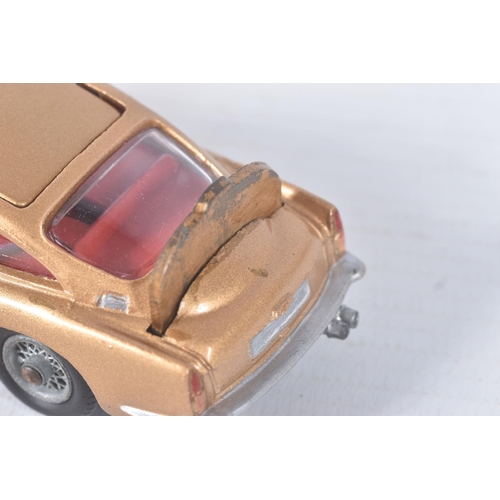 155 - A BOXED CORGI TOYS JAMES BOND ASTON MARTIN D.B.5, No.261, an example of the rarer toffee gold versio... 