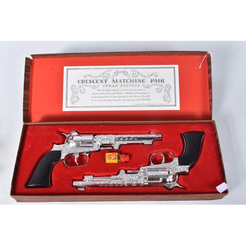 157 - A BOXED CRESCENT MATCHING PAIR OF TEXAS PISTOLS CAP GUN SET, both appear complete and in very good c... 