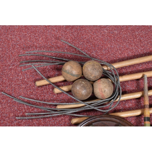 164 - A CROQUET SET, with six wooden mallets, six metal hoops, two wooden pegs and four wooden balls, in p... 