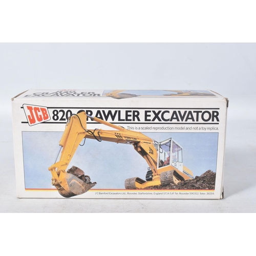 180 - A BOXED CONRAD NZG J.C.B. 820 CRAWLER EXCAVATOR, No.286, 1:35 scale, appears complete and in good co... 