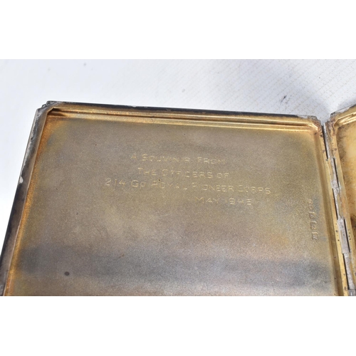 226 - A WINSTON CHURCHILL BISCUIT TIN, containing a hallmarked silver cigarette holder, a cased set of bin... 