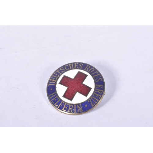 232 - TWO GERMAN RED CROSS BADGES, one is marked of the rear Ges Gesh ST&L and weighs approximately 9.9g, ... 