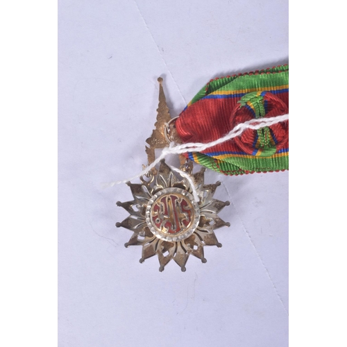 233 - A THAILAND ORDER OF THE WHITE ELEPHANT MEDAL, with ribbon rosette, this award is 5th class and comes... 