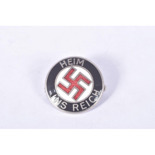 235 - TWO GERMAN PIN BADGES, to include an NSDAP Nazi Party DVG Westmark (LOTHR) badge, and a HEIM INS REI... 