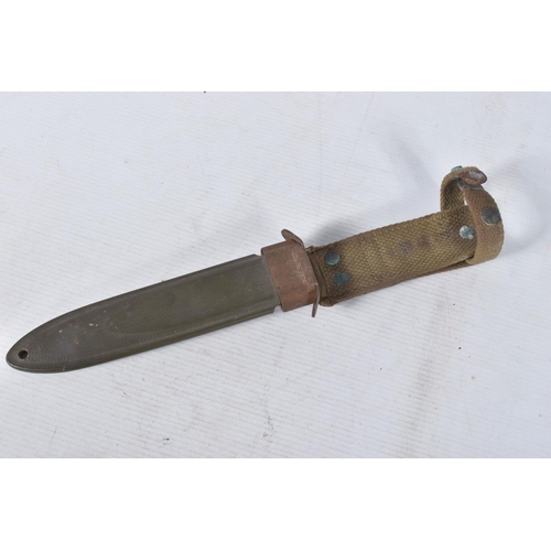 239 - A US ARMY FIGHTING KNIFE, the blade is clearly marked 'U.S.M3 PAL' but has no date, the scabbard and... 