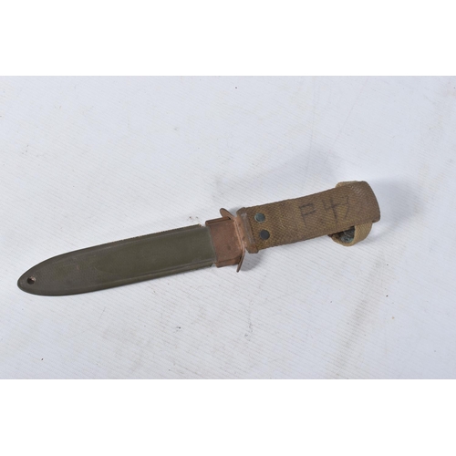 239 - A US ARMY FIGHTING KNIFE, the blade is clearly marked 'U.S.M3 PAL' but has no date, the scabbard and... 