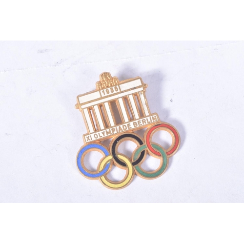 255 - THREE BERLIN OLYMPIC BADGES TO INCLUDE A VISITORS BADGE with white enamel and five coloured rings, a... 