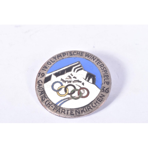 256 - TWO 1936 BERLIN OLYMPIC BADGES, these are from both summer and winter games, the first is red and bl... 