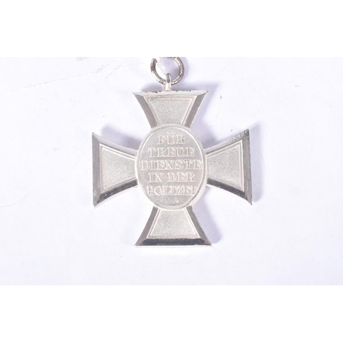 258 - A GERMAN THIRD REICH POLICE 18 YEAR LONG SERVICE CROSS, the award comes in a green/grey hinged box a... 