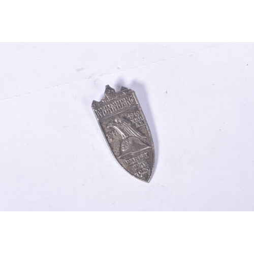 260 - A GERMAN NSDAP 1929 NUREMBURG SILVER SHIELD WITH PIN, this is the hollow back version and comes in a... 