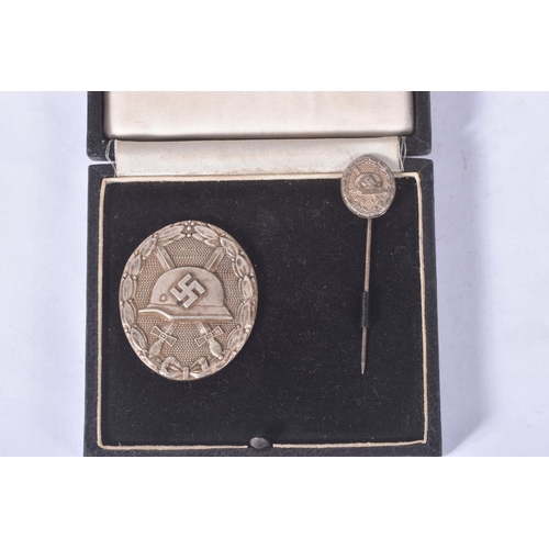 275 - A GERMAN SILVER WAR BADGE AND STICK PIN, and a 1942 cholm shield, the would badge is maker marked wi... 