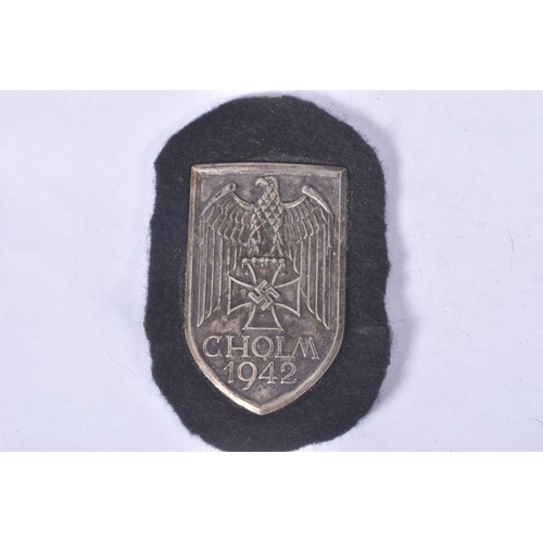 275 - A GERMAN SILVER WAR BADGE AND STICK PIN, and a 1942 cholm shield, the would badge is maker marked wi... 