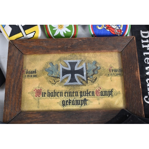 348 - A BOX OF MILITARIA, to include a believed to be period family memorial of a German Iron Cross in a f... 