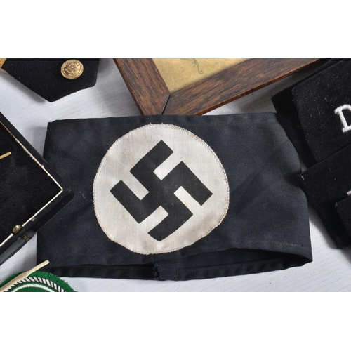 348 - A BOX OF MILITARIA, to include a believed to be period family memorial of a German Iron Cross in a f... 